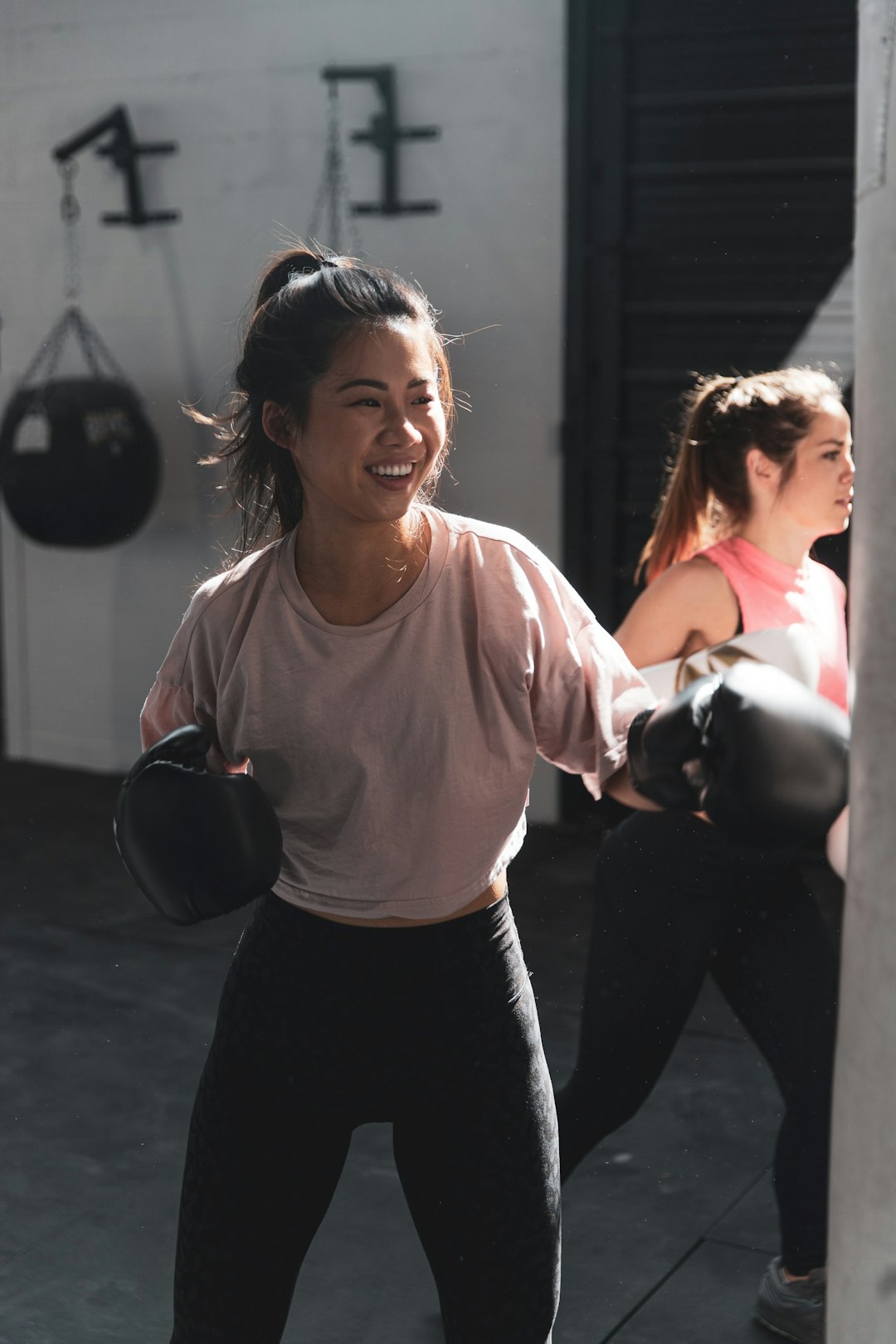 Coach mid workout holding a kettlebell